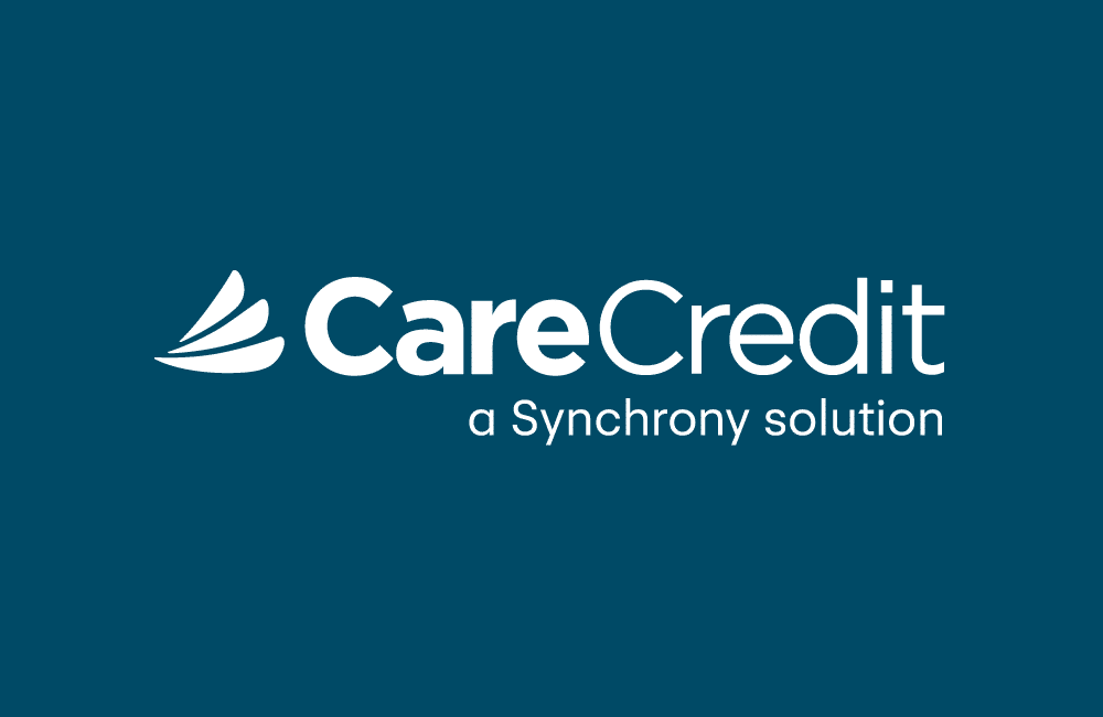 CareCredit logo with a stylized wing design on the left. The text reads “CareCredit” in large letters and “a Synchrony solution” beneath, all on a dark teal background—a trusted choice for Vet or Veterinarian payment solutions.